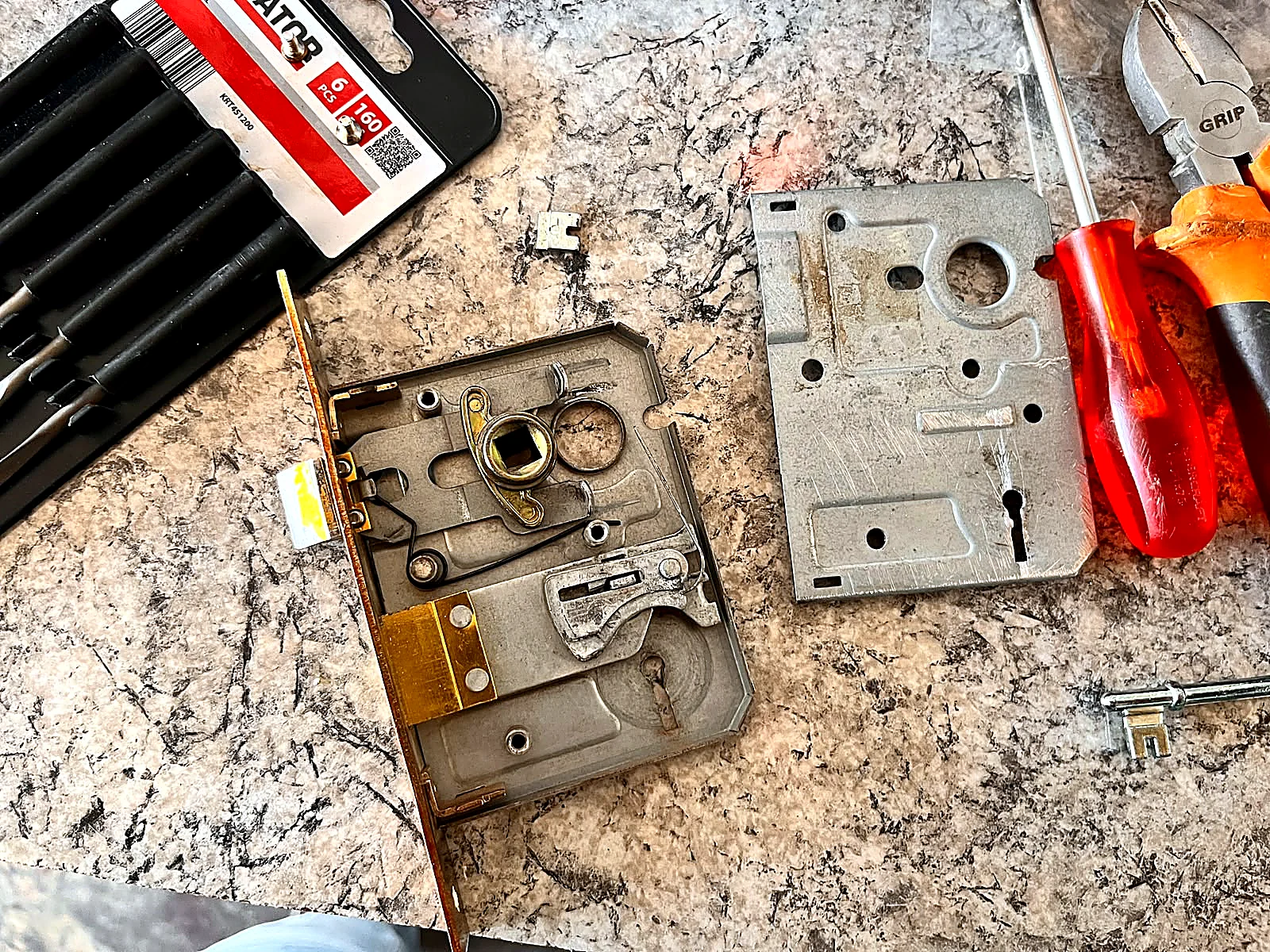 Lock mechanism being repaired by Ilanga Locksmith